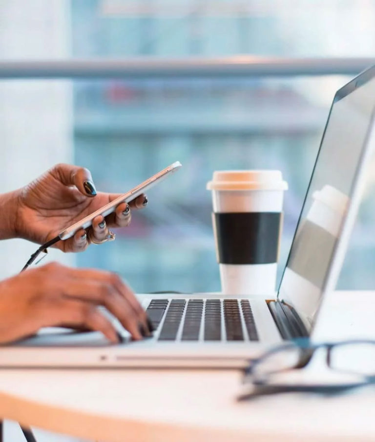 phone and laptop with coffee