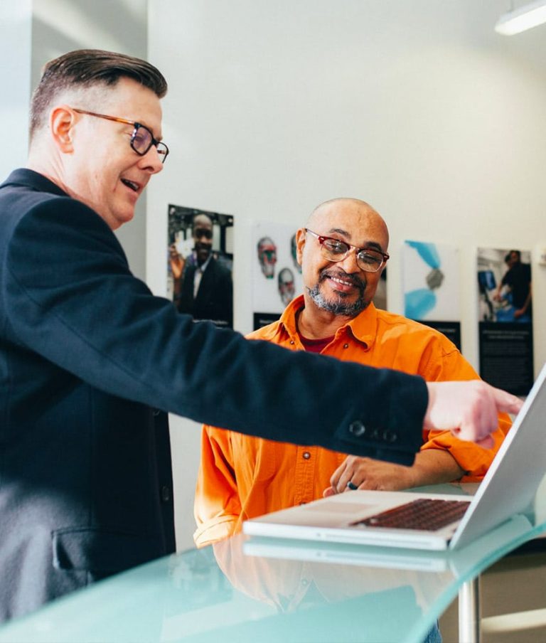 coworkers with laptop