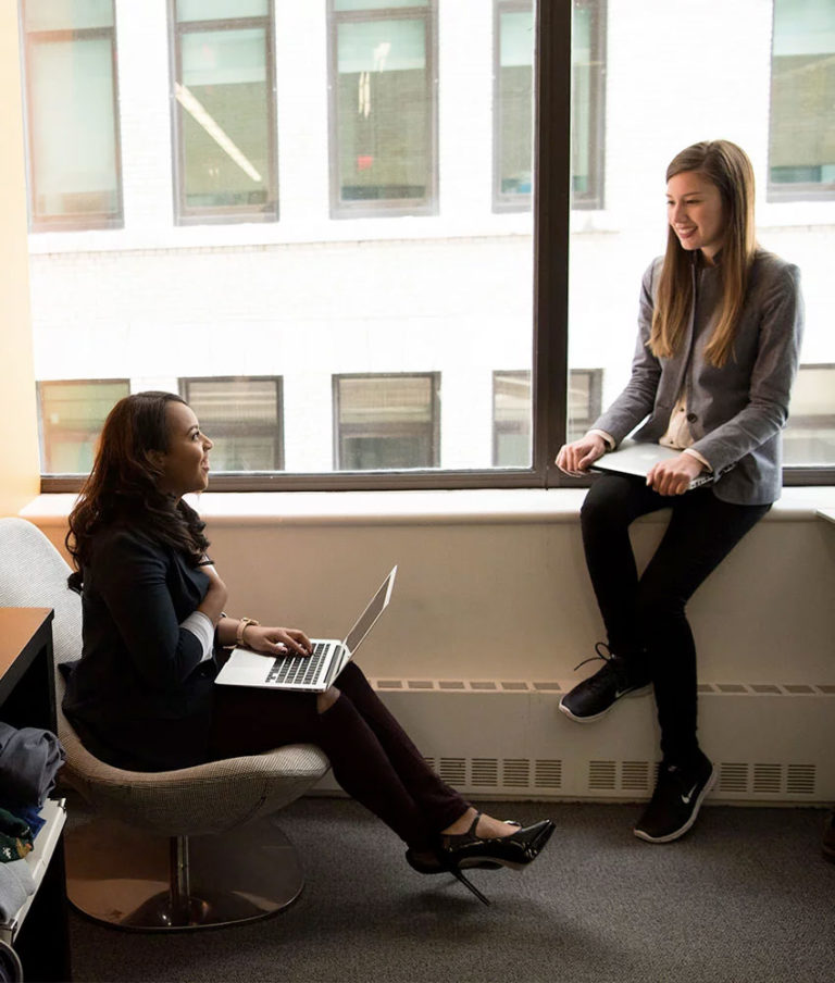 two female co-workers in a meeting