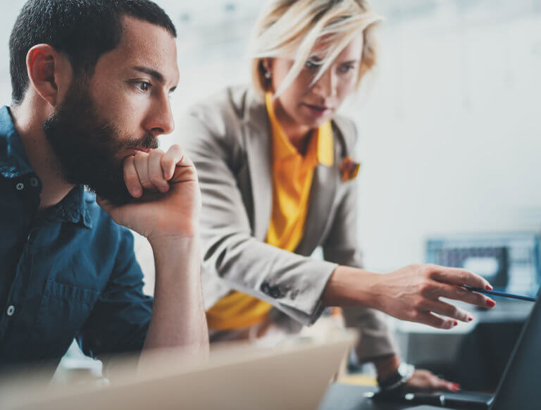 co-workers discussing CCPA on a computer