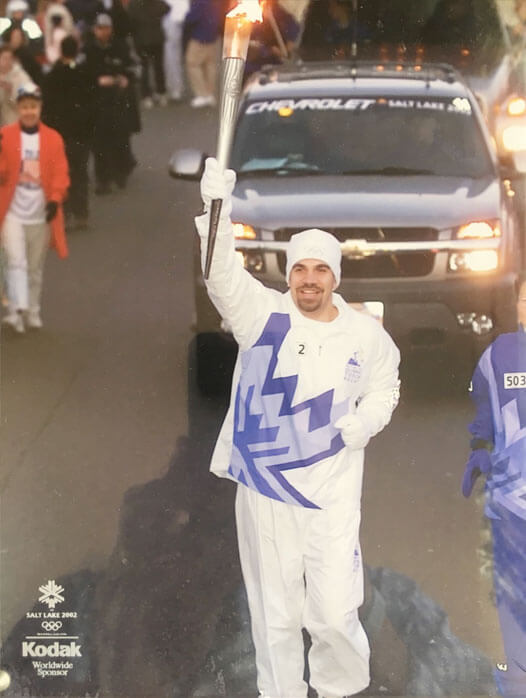 Joe Wuefling running with 2002 Olympic torch