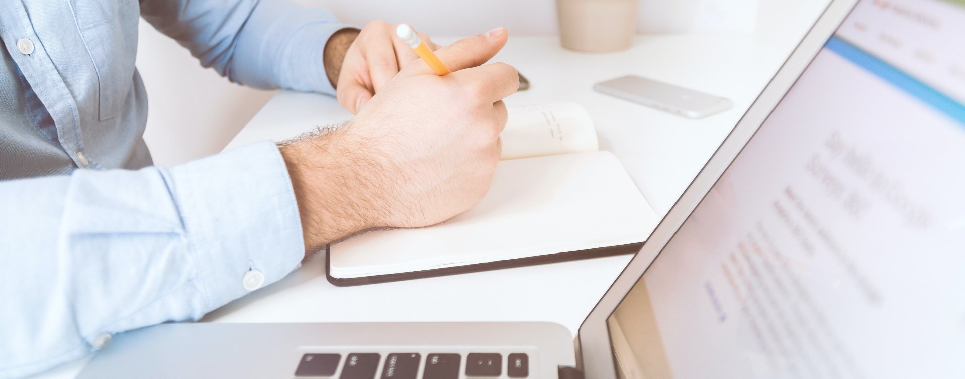 man taking notes on analytics adoption