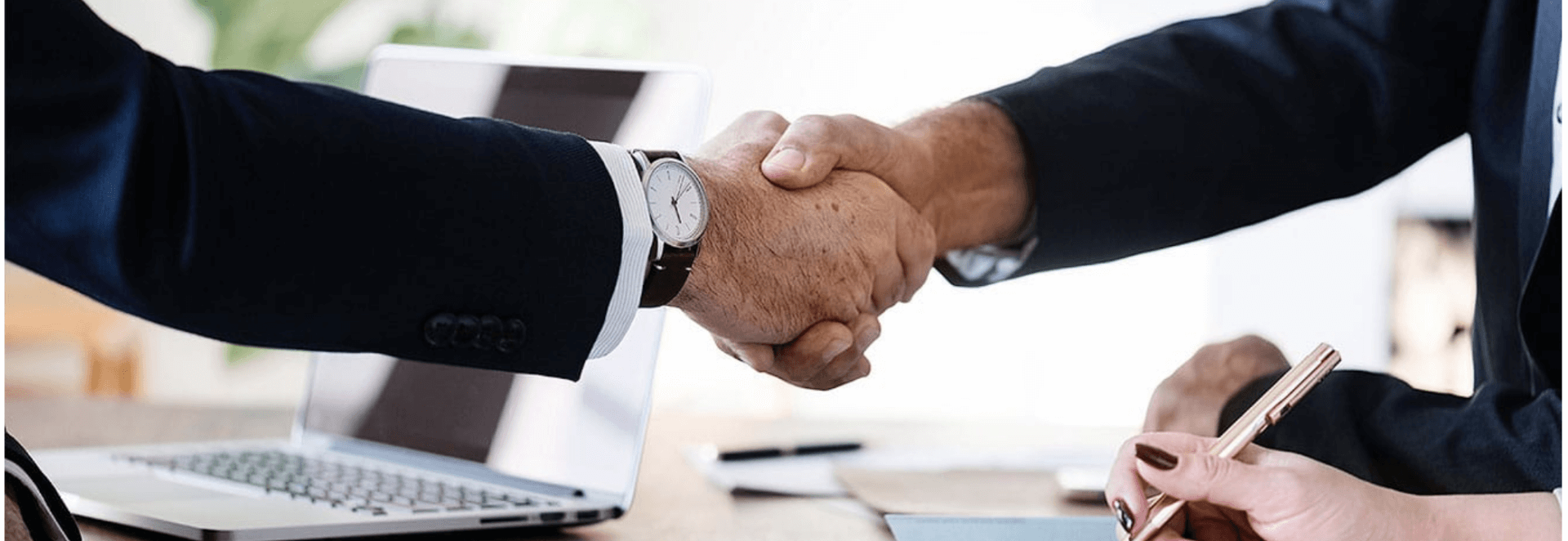 men in business suits shaking hand to represent building customer trust and respecting your customers data privacy