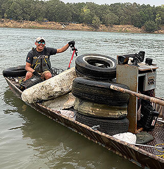 Larwnece Lemus cleaning up river