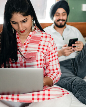 A couple uses their digital devices