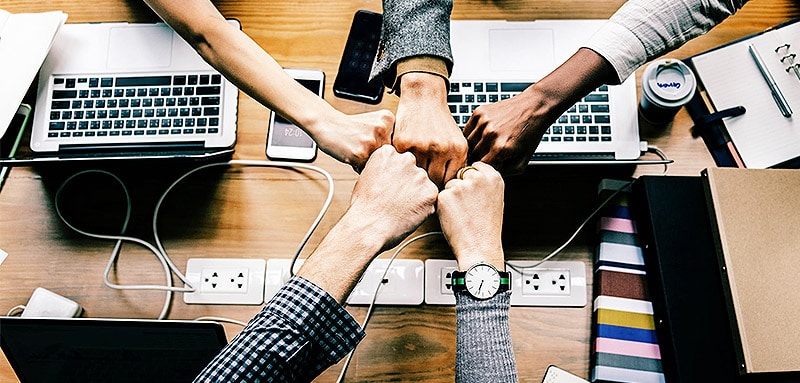 image of hands fist bumping