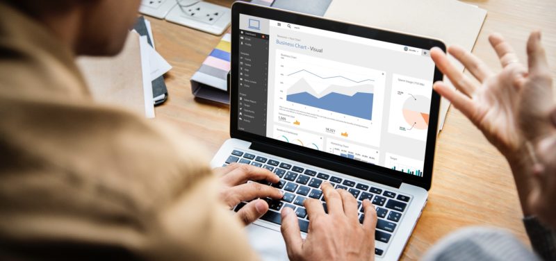 image of people looking at business chart on computer